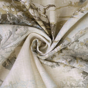 Close-up of Solene Natural/Aqua bedding fabric showing its woven texture and detailed scenic toile print