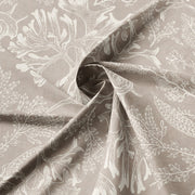Close-up of Shellabrate Natural fabric showing ivory seashell and coral motifs on a beige background