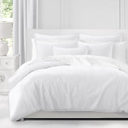 Adrianne White duvet cover with coordinating white pillow shams on a bed