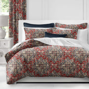 Charvi red and blue duvet cover set with Kilim-inspired motif on bed, handcrafted in Canada with linen blend fabric