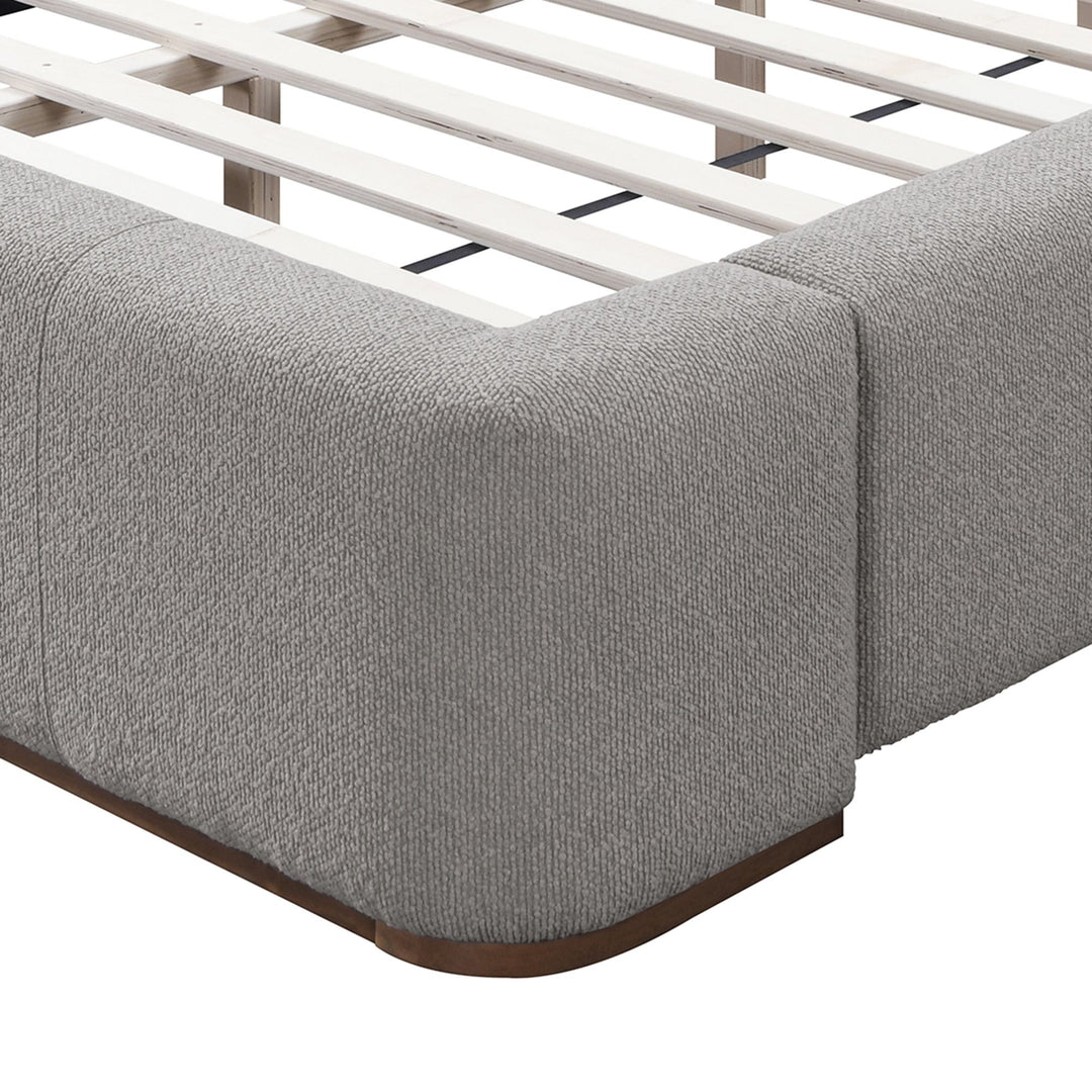 Close-up of Harrod platform bed showing textured mushroom fabric and walnut-finished base