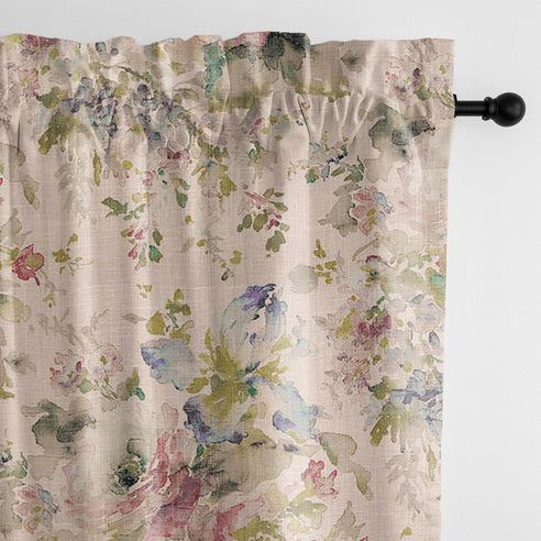 Close-up of Blossom Blush pole top drapery panel with pink, green and blue floral detailing on a pale blush background.