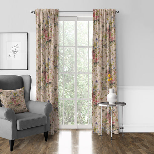 Blossom Blush floral drapery panels framing a tall window beside a grey armchair and round side table.
