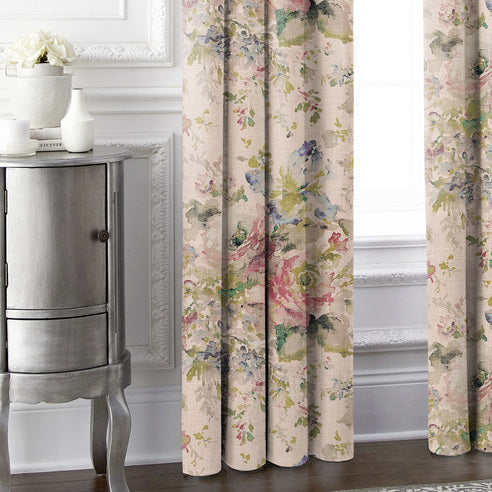 Lower detail of Blossom Blush floral drapery panels beside a silver cabinet, showing folds and floor-length hems.