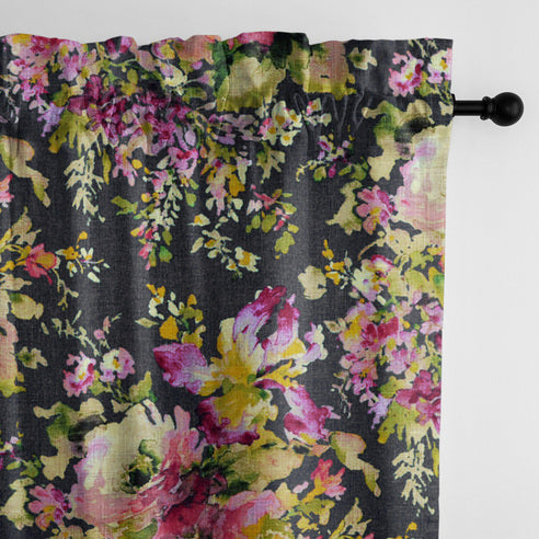 Close-up of Blossom Charcoal pole top drapery panel showing pink, purple and green floral details on a dark charcoal background.