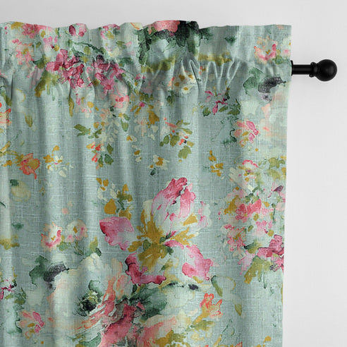 Close-up of Blossom Eggshell pole top drapery panel showing pink flowers and green foliage on a pale blue-green background.