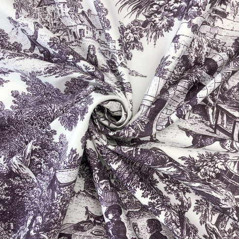 Close-up of eggplant and ivory patterned fabric with scenic design