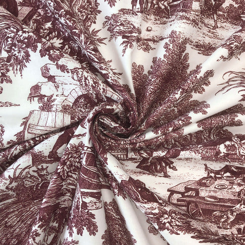 Close-up of fabric with merlot-style landscape print in ivory