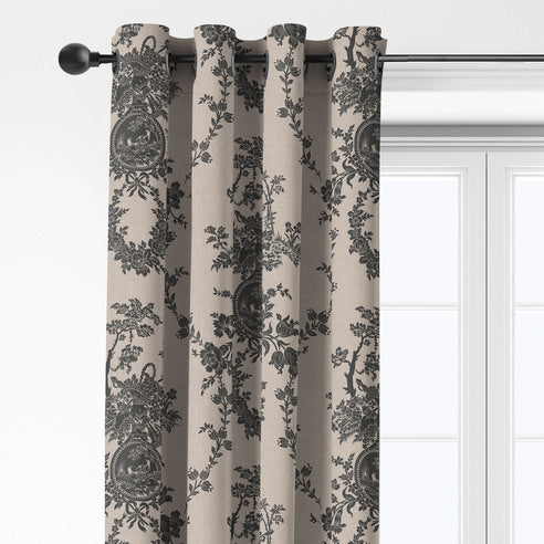Close-up of Country Lane Ebony grommet top drapery showing dark floral and medallion motifs on a beige background.