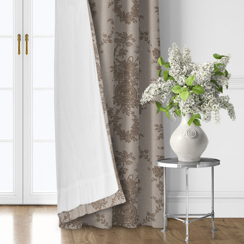 Country Lane Natural drapery panel turned back to reveal white lining, with taupe floral motifs on a beige background.