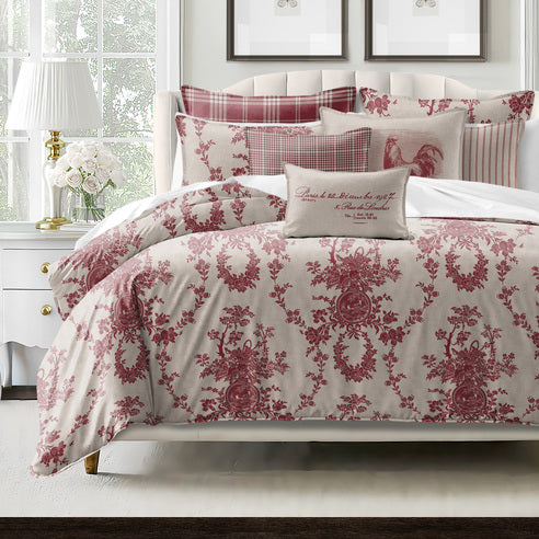 Bedroom with floral patterned bedding and pillows