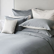 t. Genève Capri Duo 90 colour sateen duvet cover styled on a luxury bed
