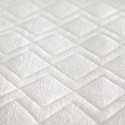 Close-up of St. Dormeir® diamond-quilted wool cotton protector fabric texture
