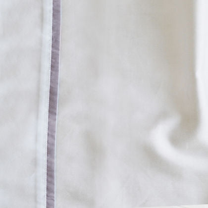 St. Genève Capri Clair sateen fabric detail showing smooth 100% Egyptian cotton weave with satin stitch trim