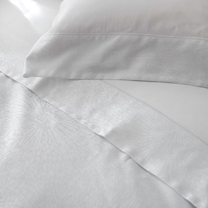 Eterna Collection Lumina Jacquard Duvet Cover styled on bed – St. Genève elegant luxury bedding