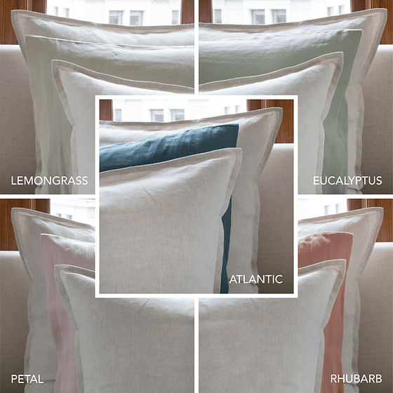 Echo linen bedding styled on bed showing reversible color options - St Genève