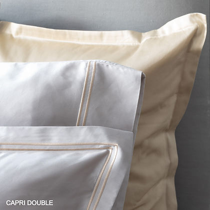 St. Genève Capri Double Satin Stitch pillowcases in cream and white — close-up of double satin stitch border detail