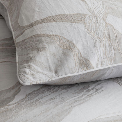 Lyric Jacquard Duvet Cover styled on bed – St. Genève cotton linen luxury bedding