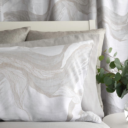 Close-up of Lyric Jacquard cotton-linen weave – St. Genève textured luxury bedding