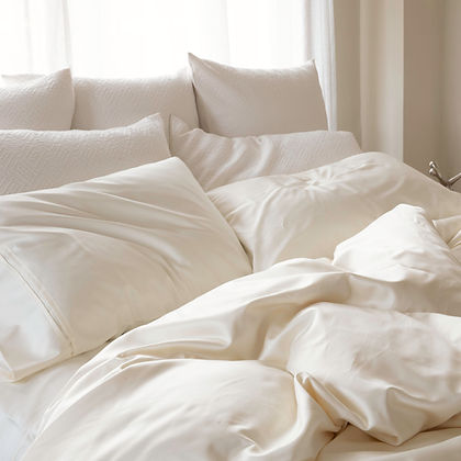 Regency Sateen Cream bedding set styled on a bed with multiple pillows – luxurious 380TC Egyptian Cotton by St. Genève
