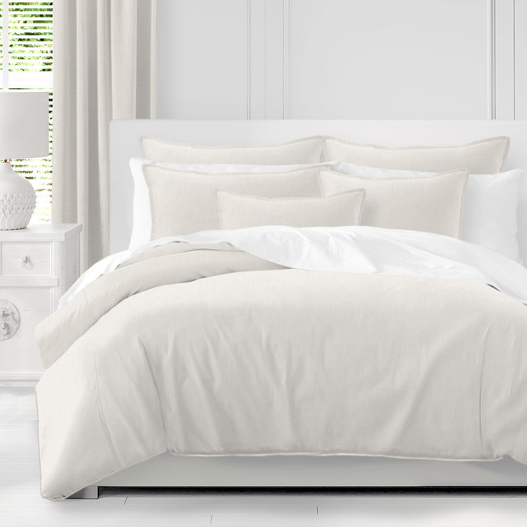 Adrianne Pearl duvet cover set in soft ivory with coordinating pillow shams on a white bed