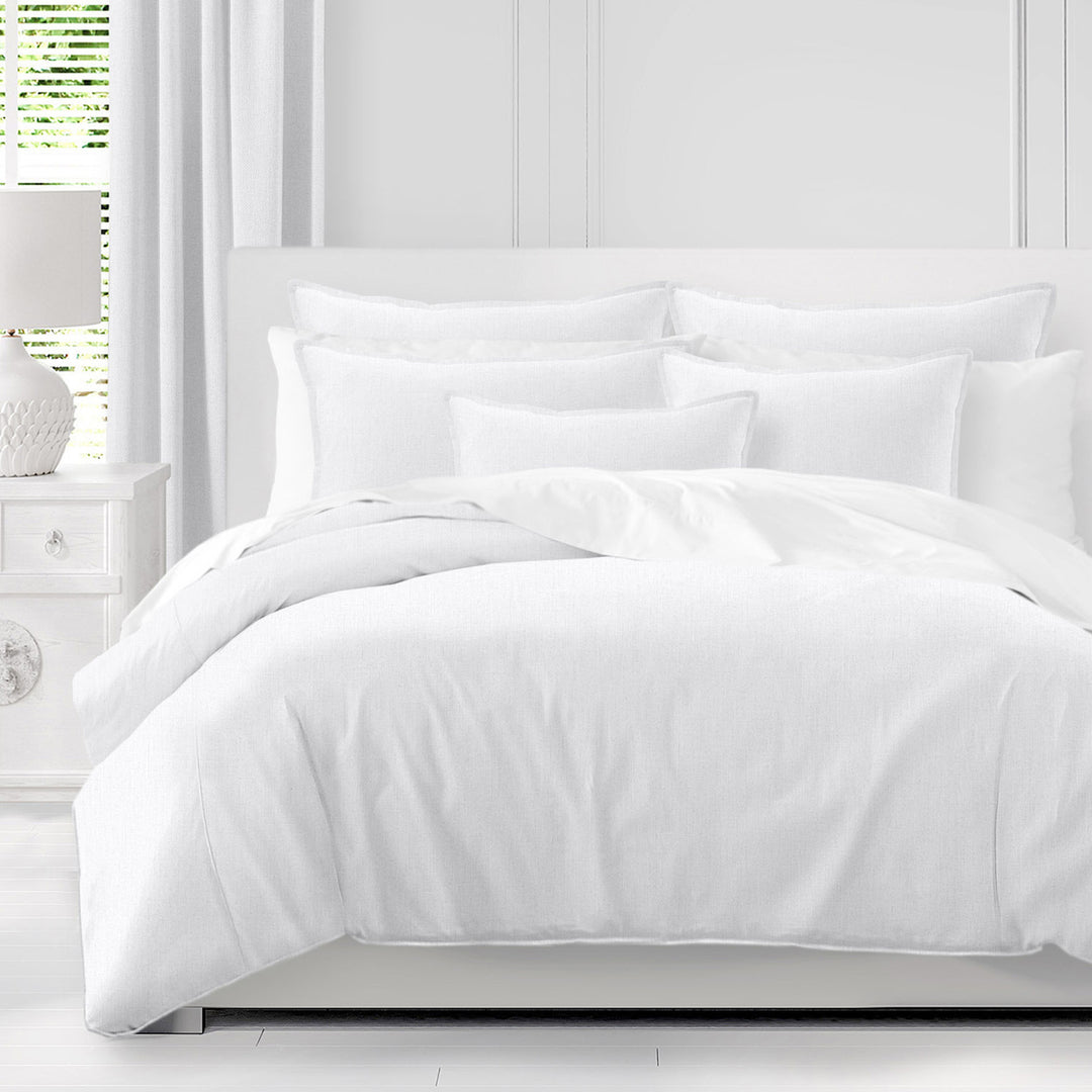 Adrianne White duvet cover with coordinating white pillow shams on a bed