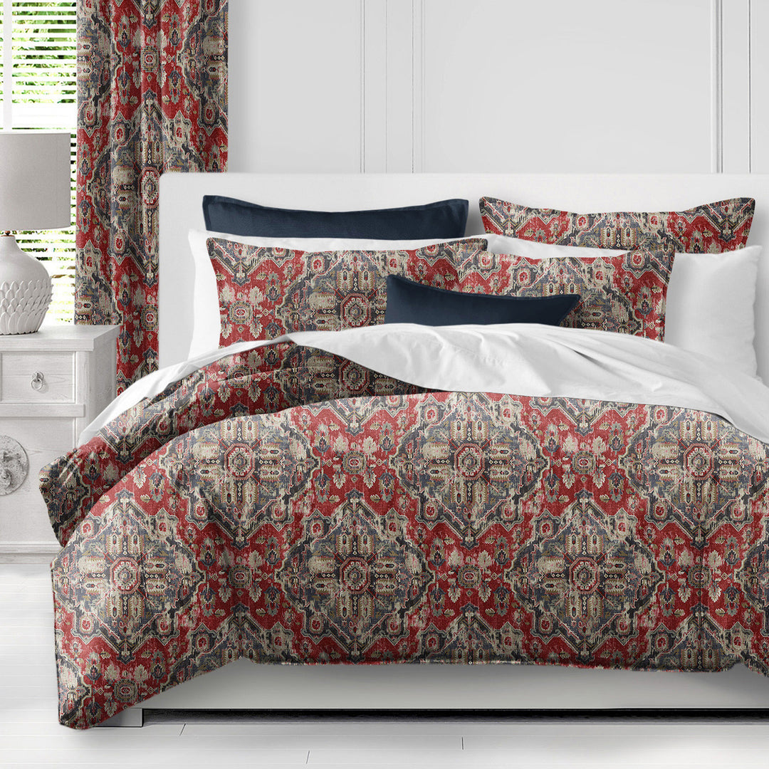 Charvi red and blue duvet cover set with Kilim-inspired motif on bed, handcrafted in Canada with linen blend fabric