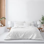Elite Linen White duvet cover with coordinating white pillow shams on a bed