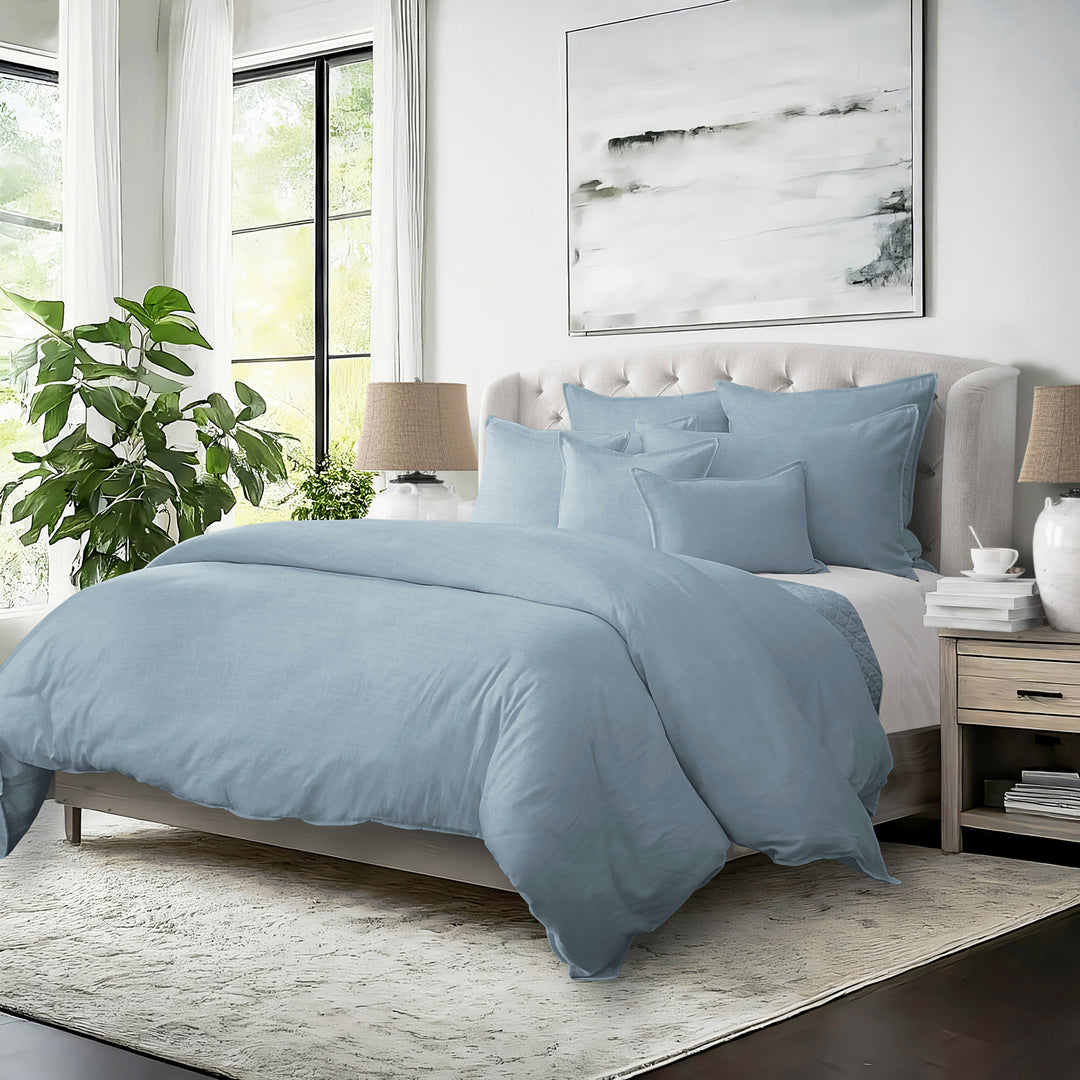 Elegant bedroom featuring Elsie cornflower blue COVERLET set with decorative pillows