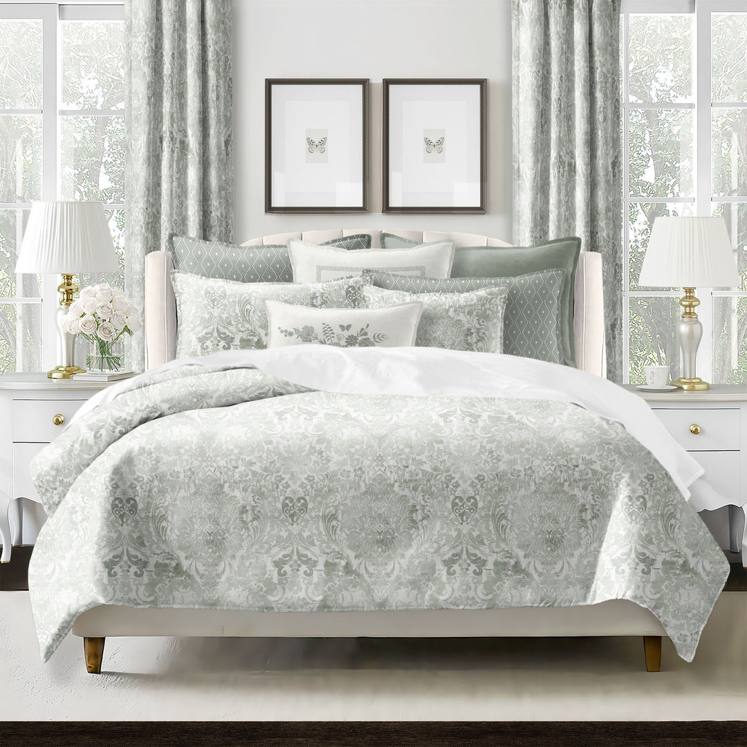 Savannah duvet cover set styled on bed with vintage-inspired damask pattern and reversible ivory cotton