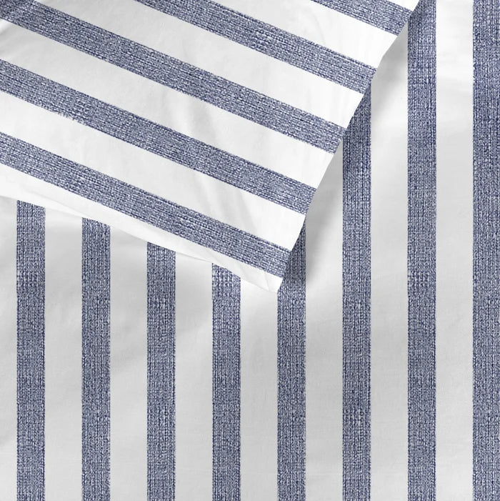 fabric detail: Ally cotton fabric detail showing textured blue stripes on a white background