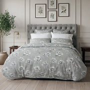 Camelia floral duvet cover and shams styled on a bed with grey tufted headboard – 100% long-staple cotton by Cuddle Down
