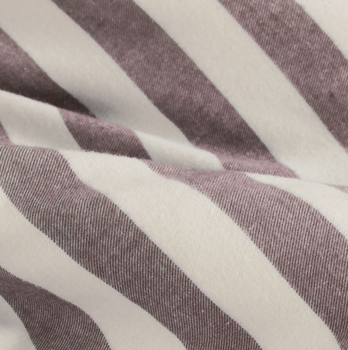 closer view: Close-up of Elias cream and burgundy striped flannel duvet cover folded back beneath matching pillows