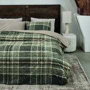 full bed: Elliot green and cream plaid cotton flannel duvet cover styled on a bed with a matching pillow