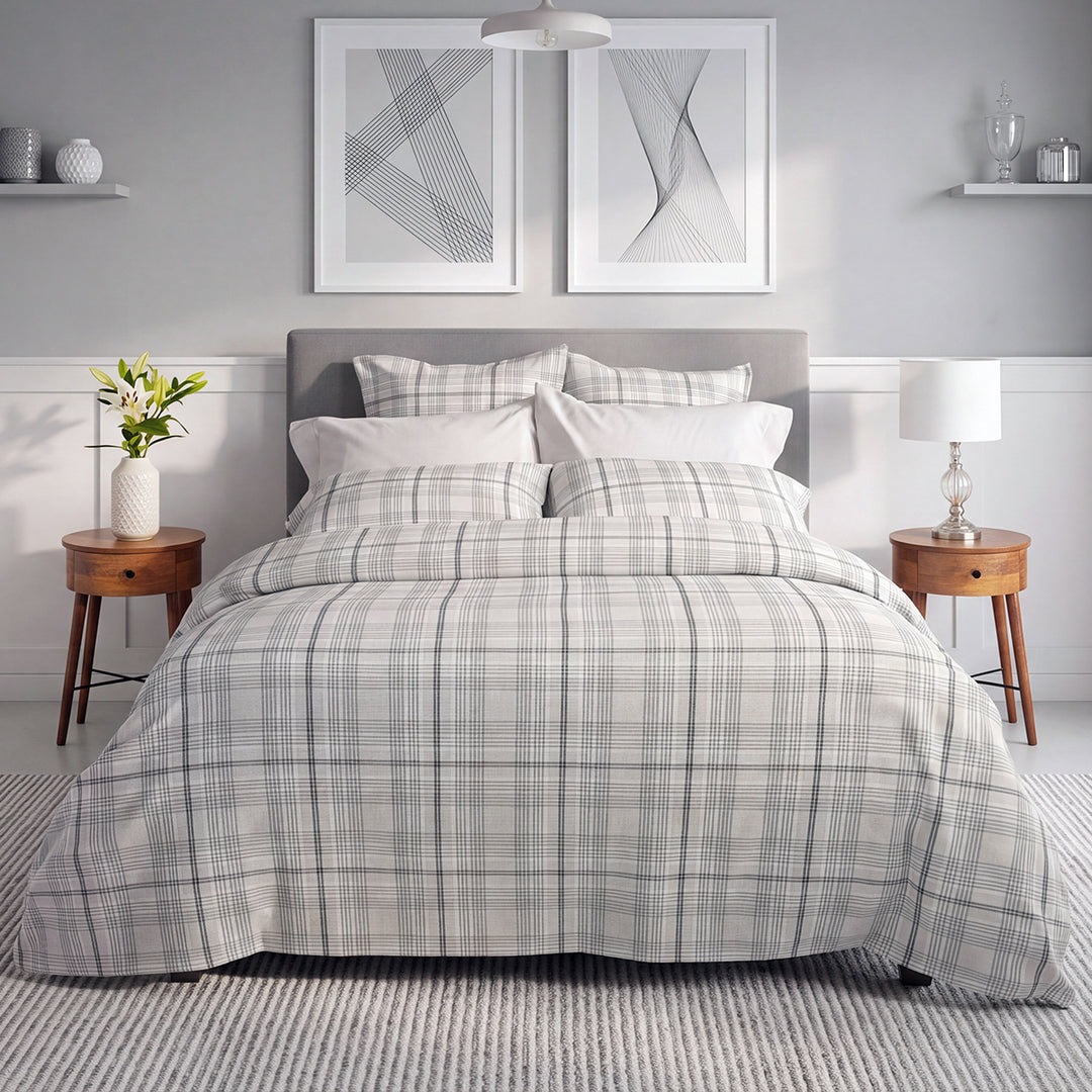 Grayson grey plaid flannel duvet cover and shams styled on a bed with grey upholstered headboard – warm cozy flannel bedding by Cuddle Down

