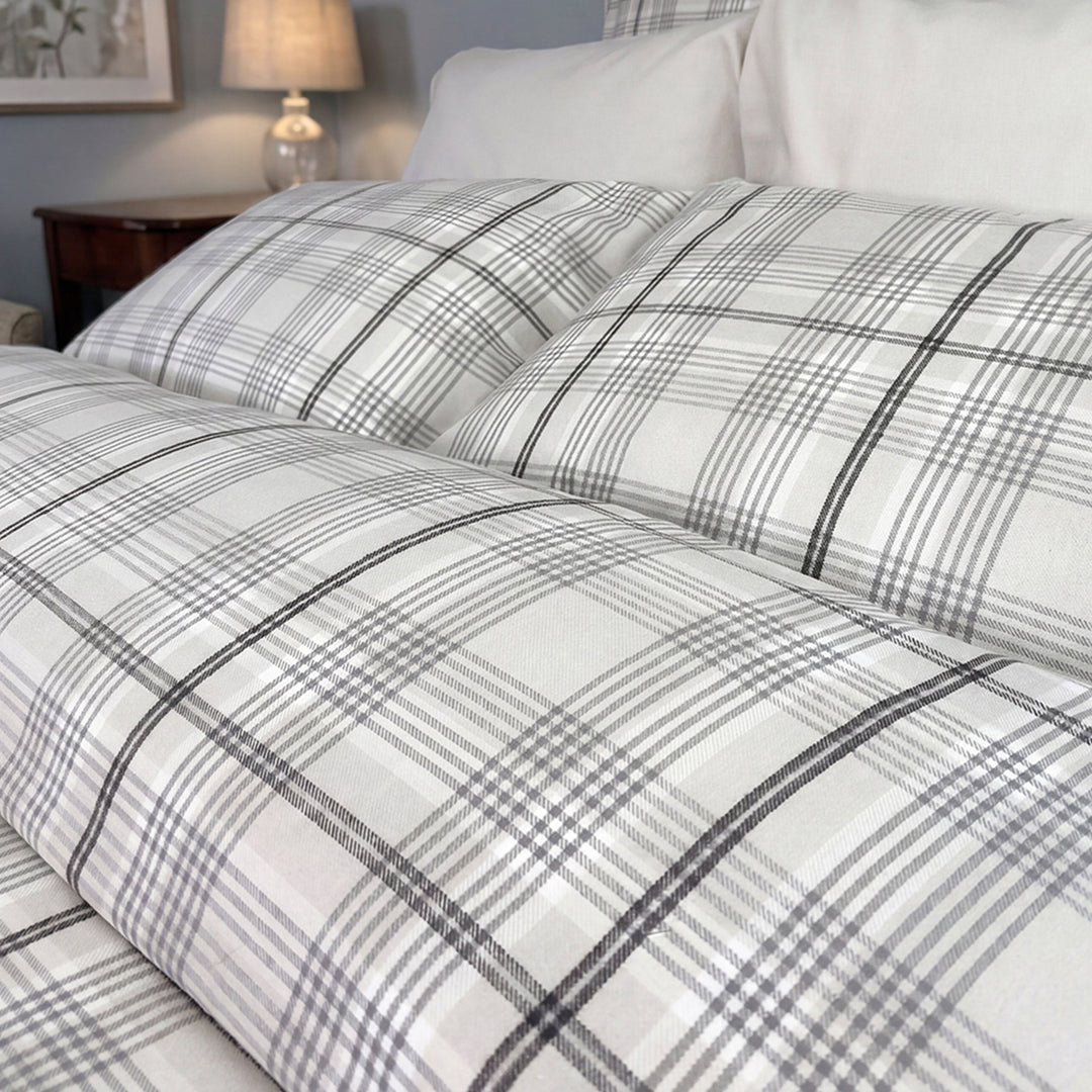 Close-up of Grayson grey and white plaid flannel duvet cover and pillow shams – soft warm flannel bedding by Cuddle Down
