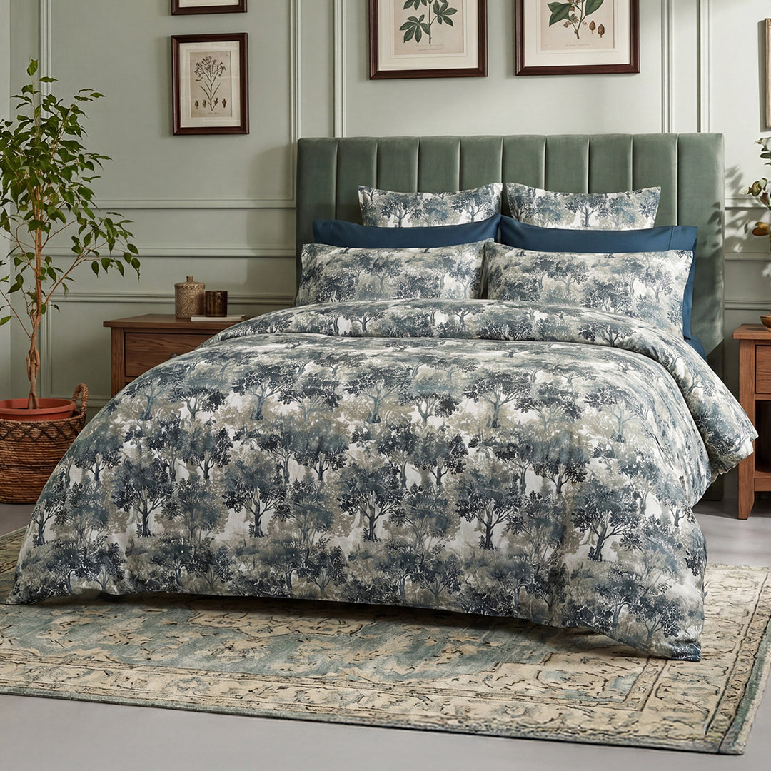 Greenwood forest print duvet cover and shams styled on a bed with teal velvet headboard – 100% long-staple cotton by Cuddle Down
