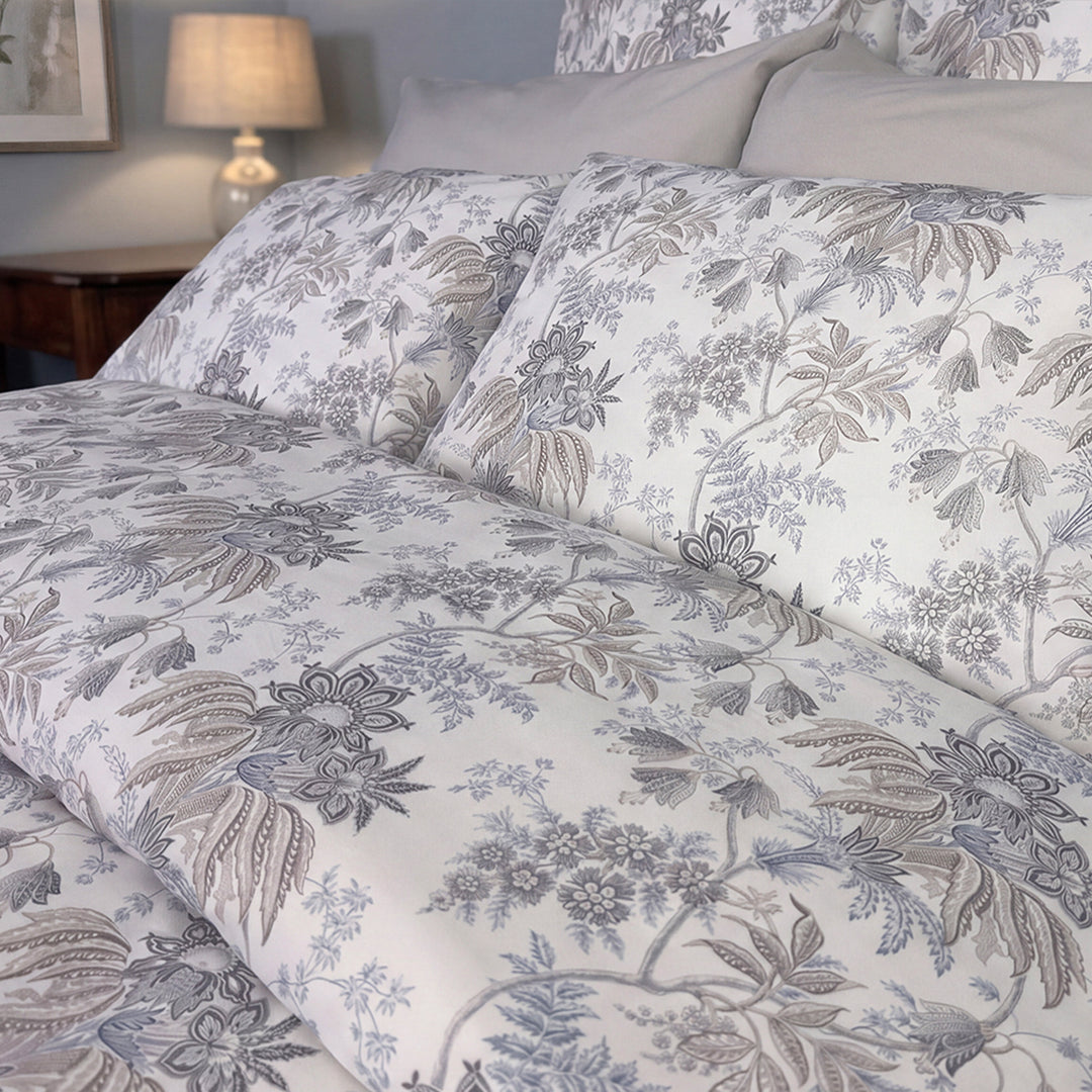 Close-up of Heather Jacobean floral print duvet cover in soft grey and blue on white – percale cotton bedding by Cuddle Down
