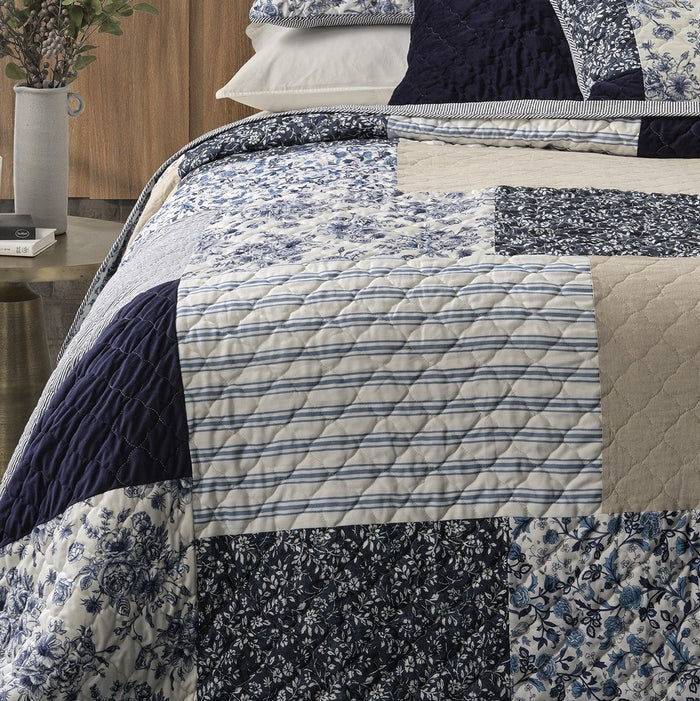 Close-up of Marine Navy and White Patchwork Quilt – Geometric Pattern Detail