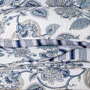 Close-up of Nil reversible quilt set showing navy and white pattern – luxury Canadian bedding