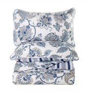 Floral patterned bedding set with a pillow  on a white background