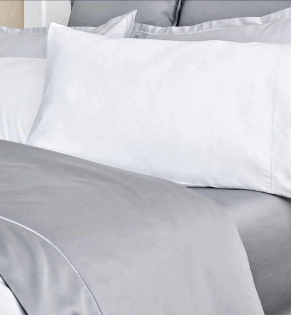 Close-up of luxury bed sheet fabric — care and washing tips for premium linens at Bed & Bath Home Decor
