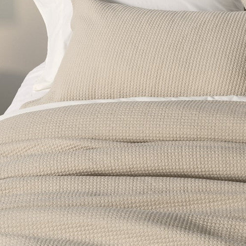 closer view: Close-up of Rustic natural beige jersey duvet cover and matching pillow, showing the quilted texture