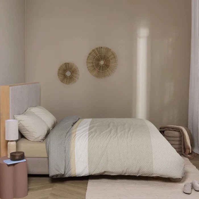 ull bed: Strom cotton duvet cover with geometric patterns in grey, beige and white, styled on a bed with matching pillows