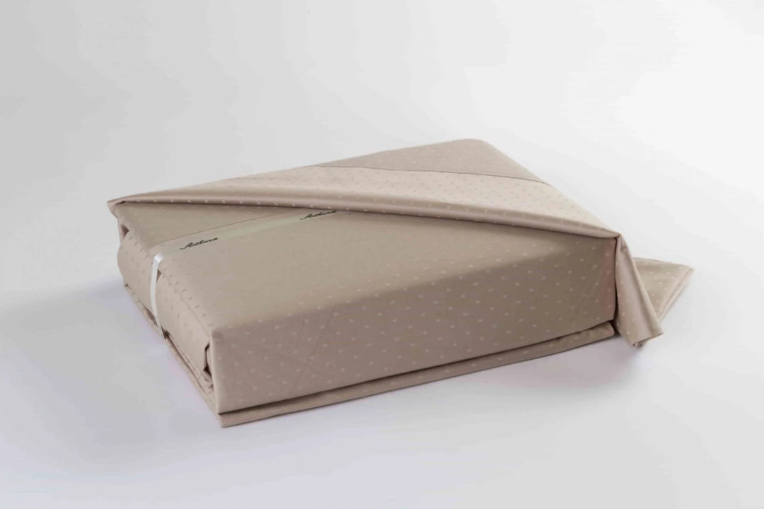  Athena 400 Thread Count Swiss Dots Duvet Cover Set styled on bed with decorative pillows