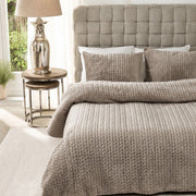 full bed: Whisper taupe duvet cover set with raised chevron-textured stripes, styled on a bed with matching pillows