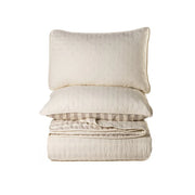 Ann Natural Solid Quilt – Embossed floral microfiber in natural, shown flat
