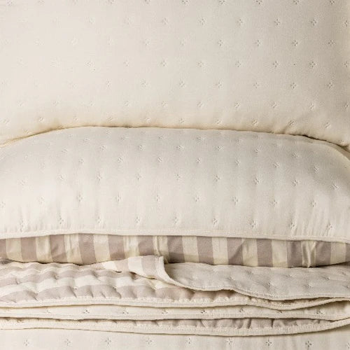 Ann Natural Solid Quilt – Embossed floral microfiber in natural, shown flat
