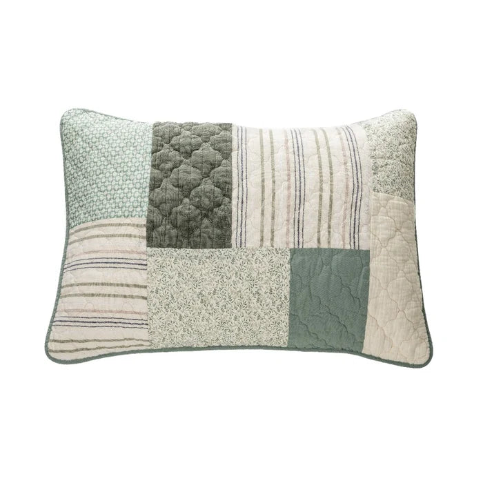 Broccolini patchwork quilt colour palette showing cream, dark olive green, grey-green, sage and dark blue swatches.