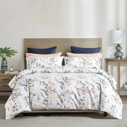 Camille duvet cover set in watercolor floral print with pink-peach blooms and blue-grey foliage on white, 300 thread count cotton sateen